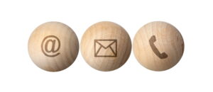 wood ball spheres have symbols at e mail address and phone on table for business marketing contact t20 pLlVjO scaled 1